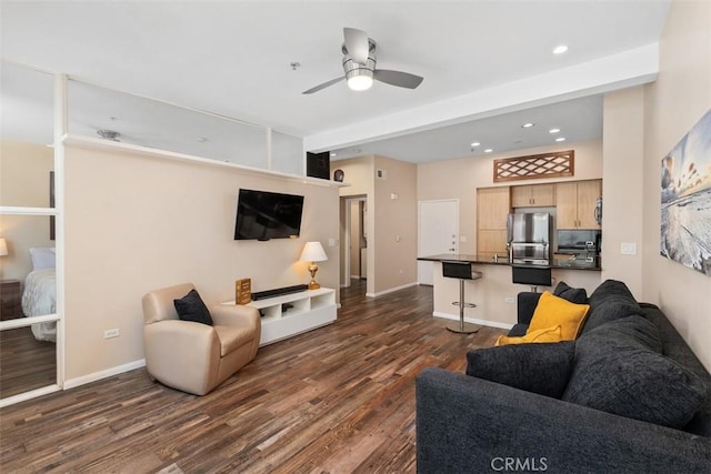 living area with a ceiling fan, recessed lighting, dark wood finished floors, and baseboards