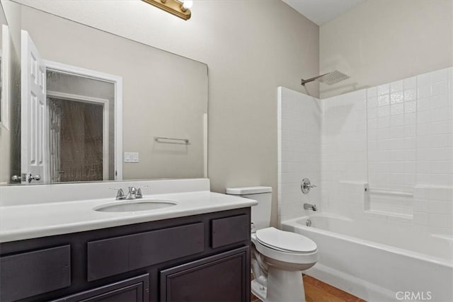 bathroom with toilet, shower / bath combination, and vanity