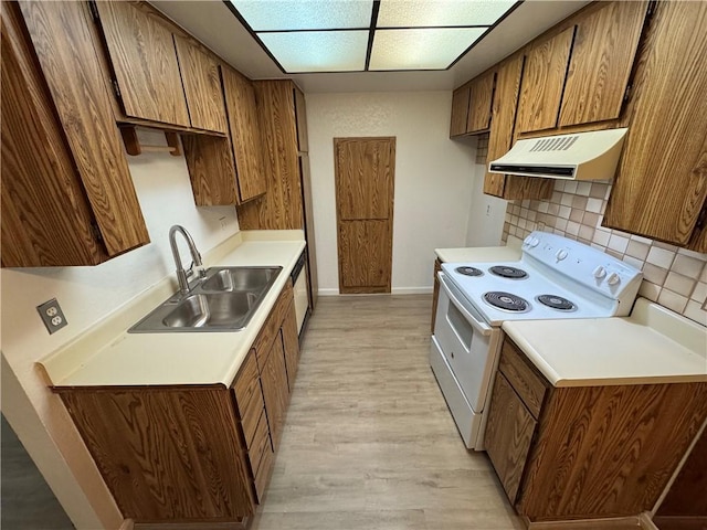 kitchen with exhaust hood, brown cabinets, a sink, and white electric range oven