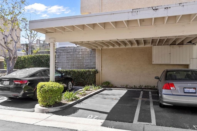 view of partially covered parking lot