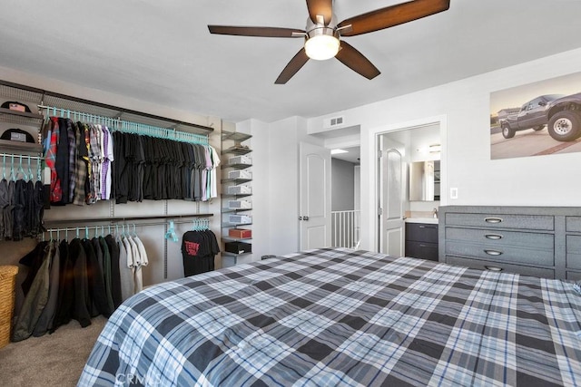 bedroom featuring a closet, carpet flooring, ceiling fan, and visible vents