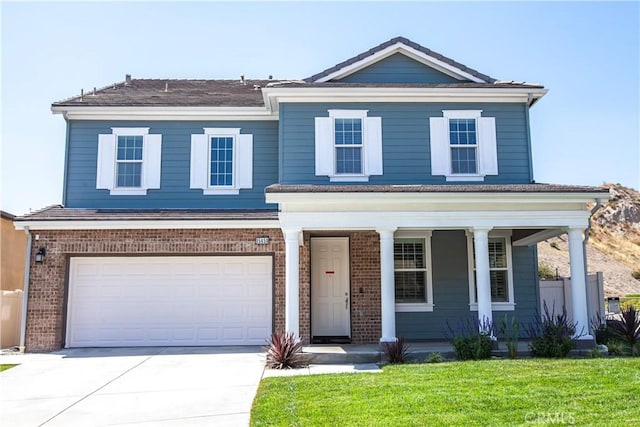 view of front of property with an attached garage, a porch, concrete driveway, and brick siding