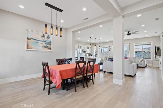 dining space with light wood-style floors, recessed lighting, and visible vents