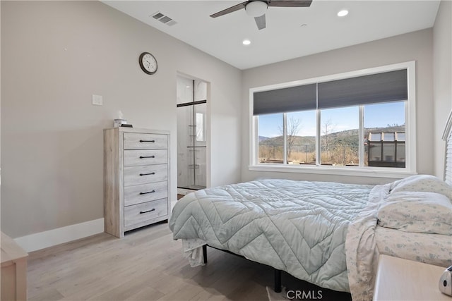 bedroom with recessed lighting, a ceiling fan, visible vents, baseboards, and light wood-type flooring