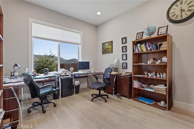 home office with baseboards, wood finished floors, and recessed lighting