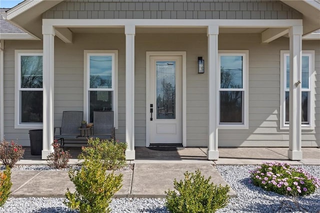 entrance to property featuring a porch