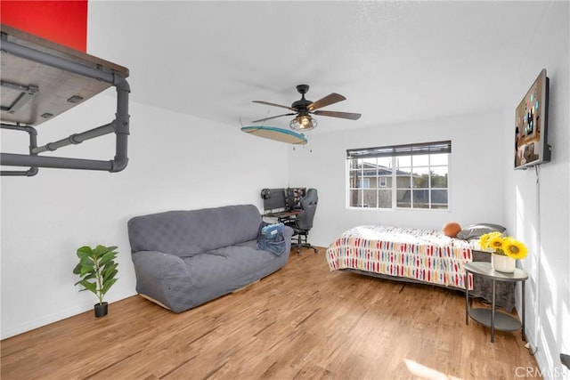 bedroom featuring ceiling fan and wood finished floors