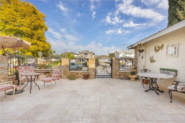 view of patio / terrace featuring a gate