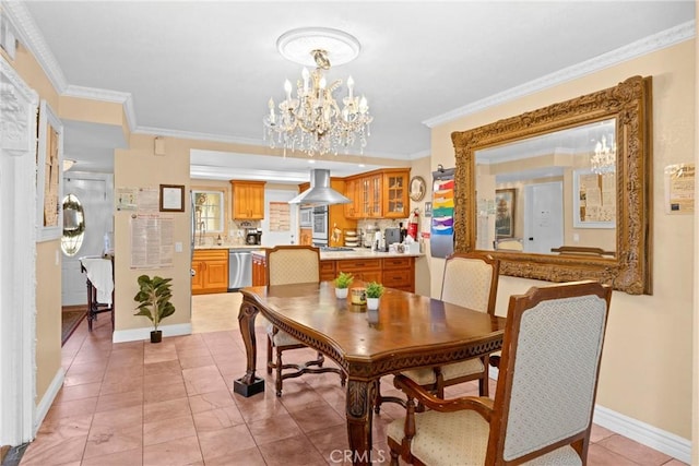 dining area with light tile patterned floors, an inviting chandelier, baseboards, and crown molding