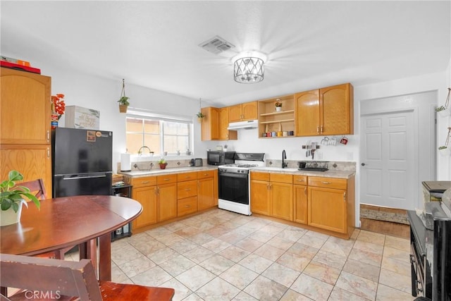 kitchen with open shelves, light countertops, visible vents, under cabinet range hood, and black appliances