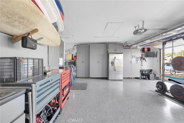 garage featuring refrigerator with ice dispenser and a garage door opener