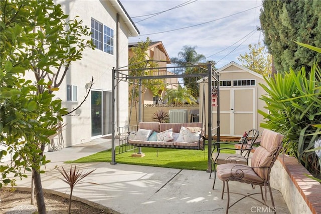 view of patio / terrace with a shed, outdoor lounge area, and an outdoor structure