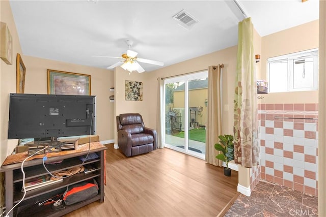 office space with ceiling fan, wood finished floors, visible vents, and baseboards