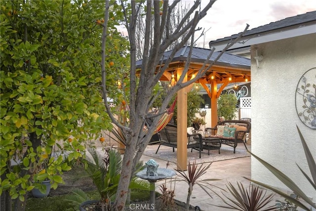 view of patio / terrace featuring outdoor lounge area and a gazebo