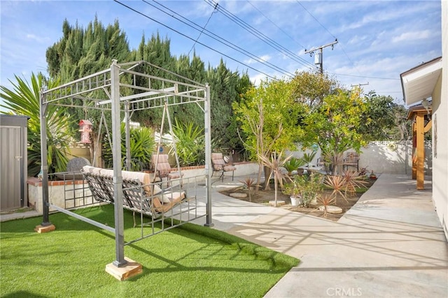 exterior space with a patio area and a fenced backyard