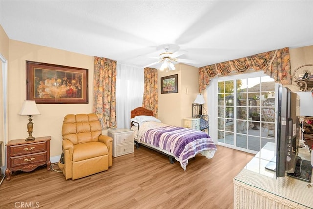 bedroom with access to outside, baseboards, light wood-style flooring, and a ceiling fan