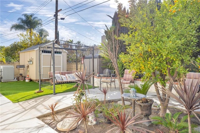 view of patio / terrace featuring an outbuilding, a storage unit, outdoor lounge area, and fence