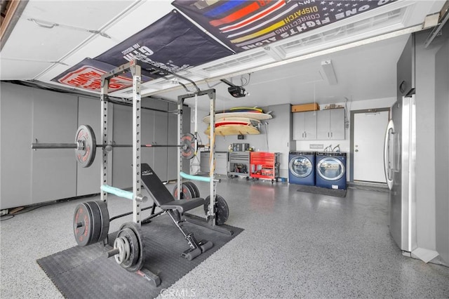 exercise room featuring a garage and separate washer and dryer