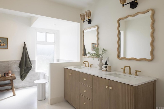 full bath featuring double vanity and a sink