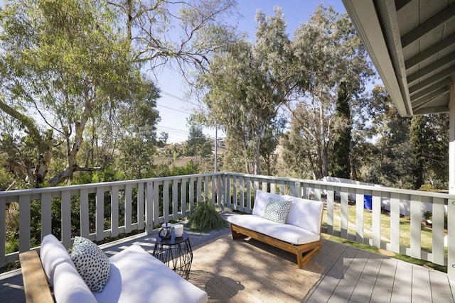 wooden deck featuring outdoor lounge area