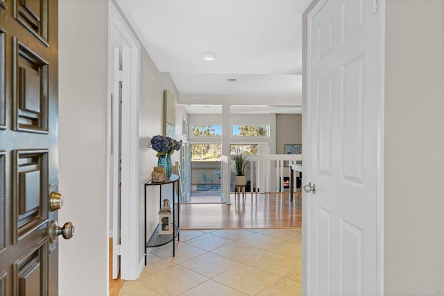 entryway with light tile patterned floors