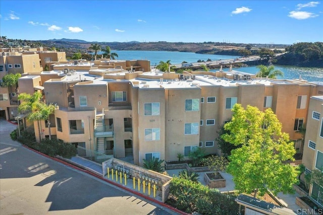 birds eye view of property featuring a water view