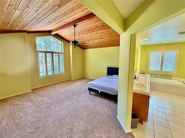 carpeted bedroom featuring vaulted ceiling with beams, wooden ceiling, tile patterned flooring, and baseboards