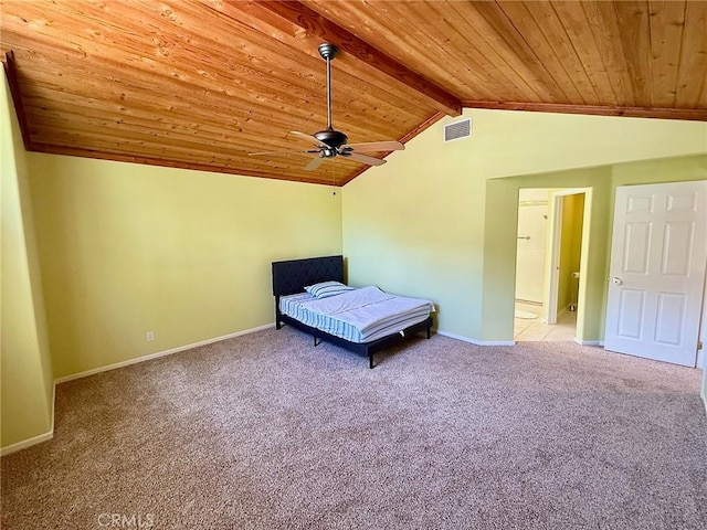 unfurnished bedroom featuring vaulted ceiling with beams, carpet flooring, wood ceiling, visible vents, and baseboards