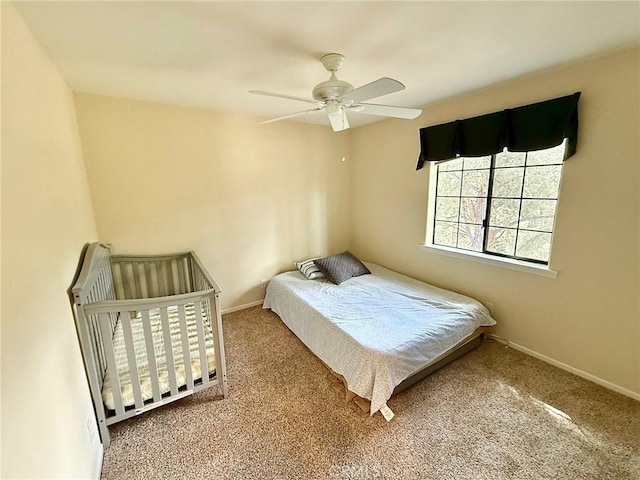 bedroom with carpet, ceiling fan, and baseboards