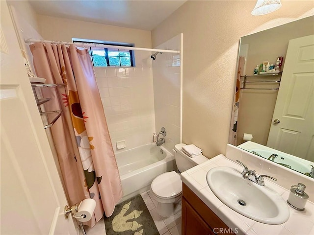 full bathroom with a textured wall, toilet, tile patterned floors, shower / bathtub combination with curtain, and vanity