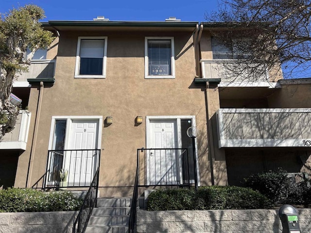 view of front of house featuring stucco siding