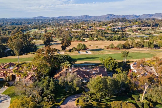 bird's eye view with a mountain view and golf course view