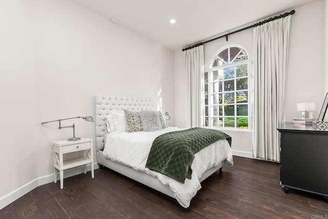 bedroom featuring dark wood-style floors, recessed lighting, and baseboards