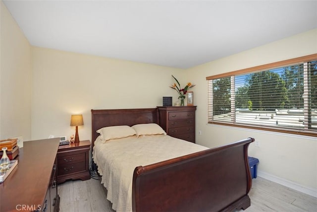 379 Avenida Castilla Unit Q, Laguna Woods, CA 92675 - bedroom with light wood-style floors and baseboards