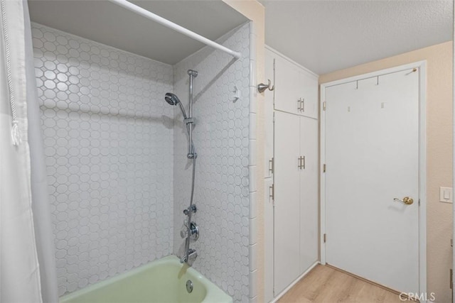 379 Avenida Castilla Unit Q, Laguna Woods, CA 92675 - full bathroom with shower / bath combination with curtain and wood finished floors