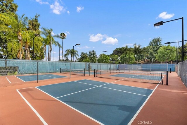 379 Avenida Castilla Unit Q, Laguna Woods, CA 92675 - view of tennis court featuring community basketball court and fence