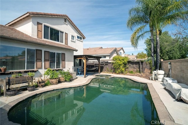 view of pool featuring a fenced backyard, an in ground hot tub, a fenced in pool, a pergola, and a patio area