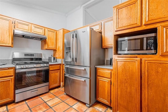 kitchen featuring crown molding, light countertops, appliances with stainless steel finishes, light tile patterned flooring, and under cabinet range hood