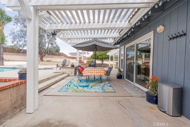 view of patio / terrace featuring outdoor dining area, fence, and a pergola