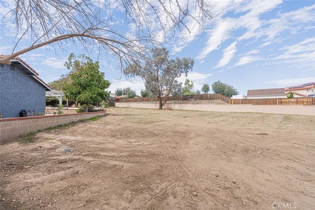 view of yard with fence and a pergola