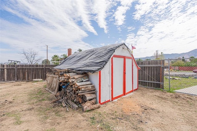 view of shed featuring a fenced backyard