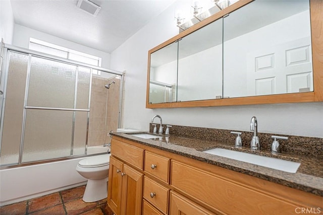 full bath with enclosed tub / shower combo, visible vents, a sink, and double vanity