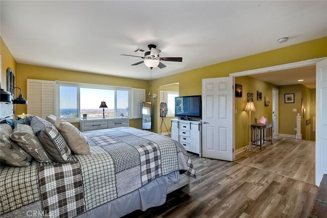 2056 Wonderview Dr, Vista, CA 92084 - bedroom featuring wood finished floors, multiple windows, and ceiling fan
