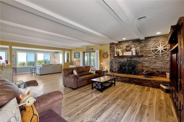 2056 Wonderview Dr, Vista, CA 92084 - living room with light wood-style flooring, beamed ceiling, and a stone fireplace