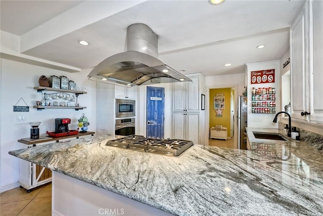 2056 Wonderview Dr, Vista, CA 92084 - kitchen featuring island exhaust hood, appliances with stainless steel finishes, light stone countertops, white cabinets, and open shelves