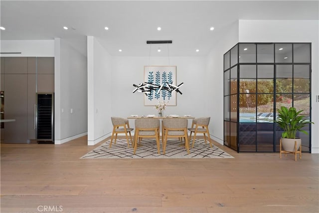 4653 Vanalden Ave, Tarzana, CA 91356 - dining space featuring wine cooler, light wood-type flooring, recessed lighting, and baseboards