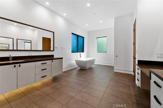 4653 Vanalden Ave, Tarzana, CA 91356 - bathroom featuring vanity, a freestanding bath, tile patterned floors, and recessed lighting