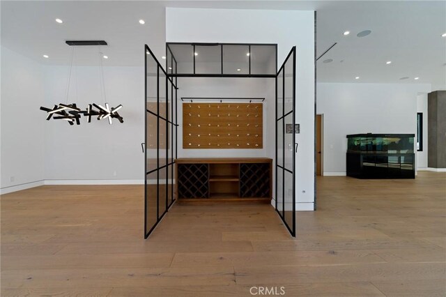 4653 Vanalden Ave, Tarzana, CA 91356 - wine room with wood finished floors, baseboards, and recessed lighting