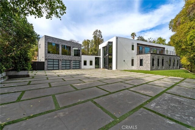 4653 Vanalden Ave, Tarzana, CA 91356 - rear view of property with stone siding and stucco siding