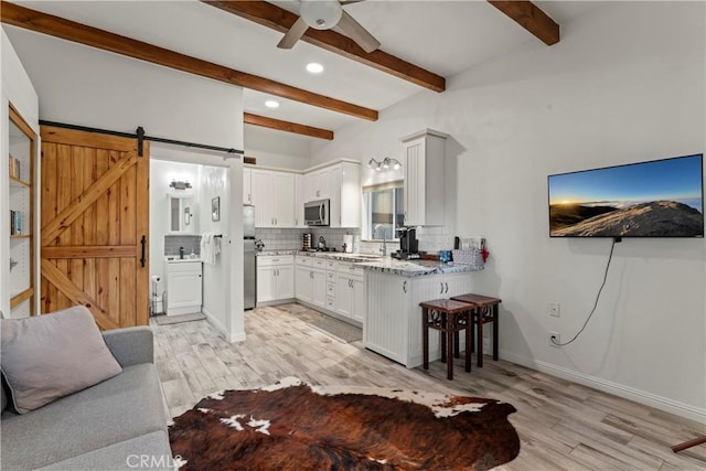750 Zurich Dr, Lake Arrowhead, CA 92352 - kitchen featuring decorative backsplash, beamed ceiling, a ceiling fan, and light wood-type flooring